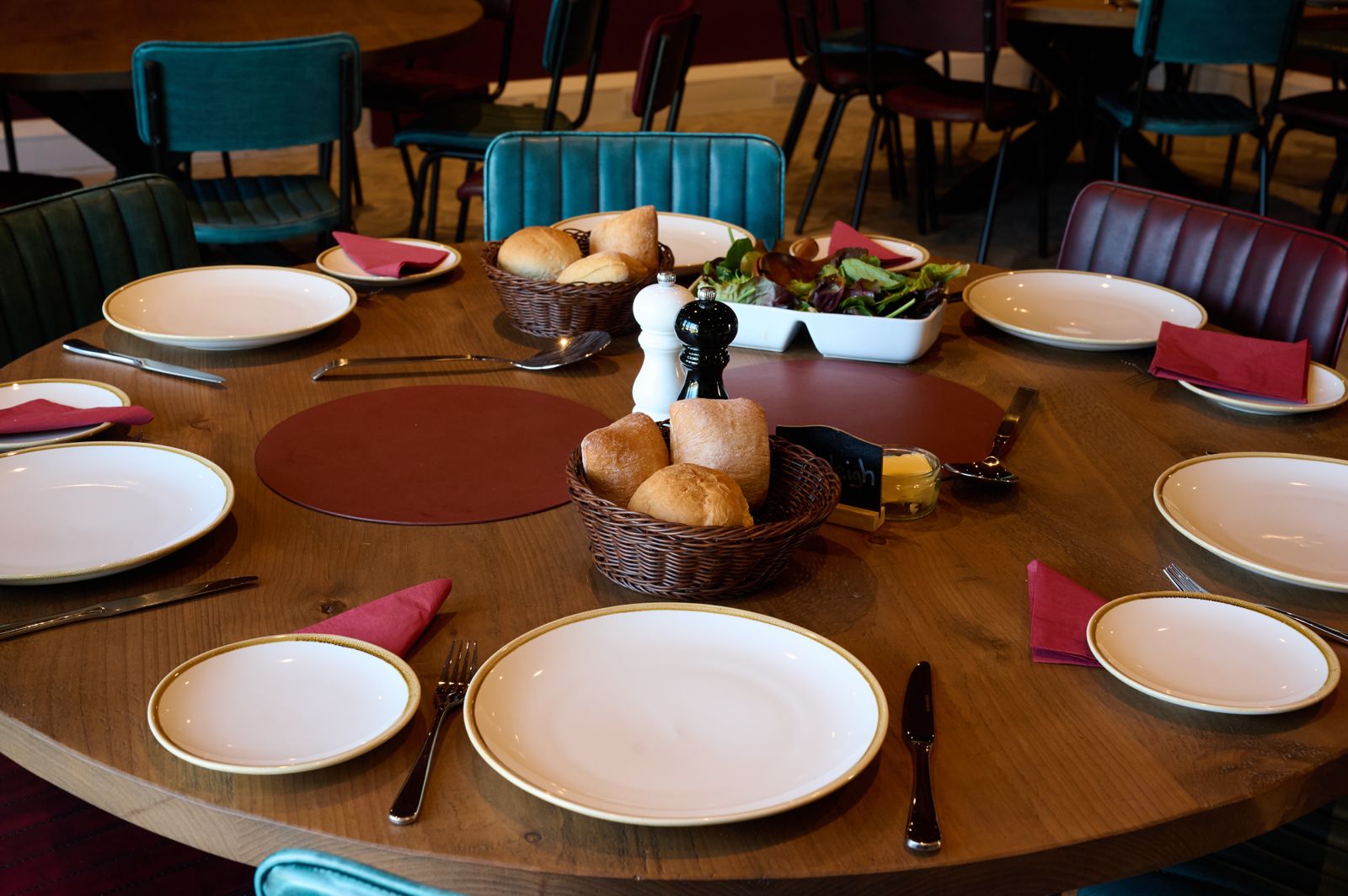 A round table laid up for eight guests