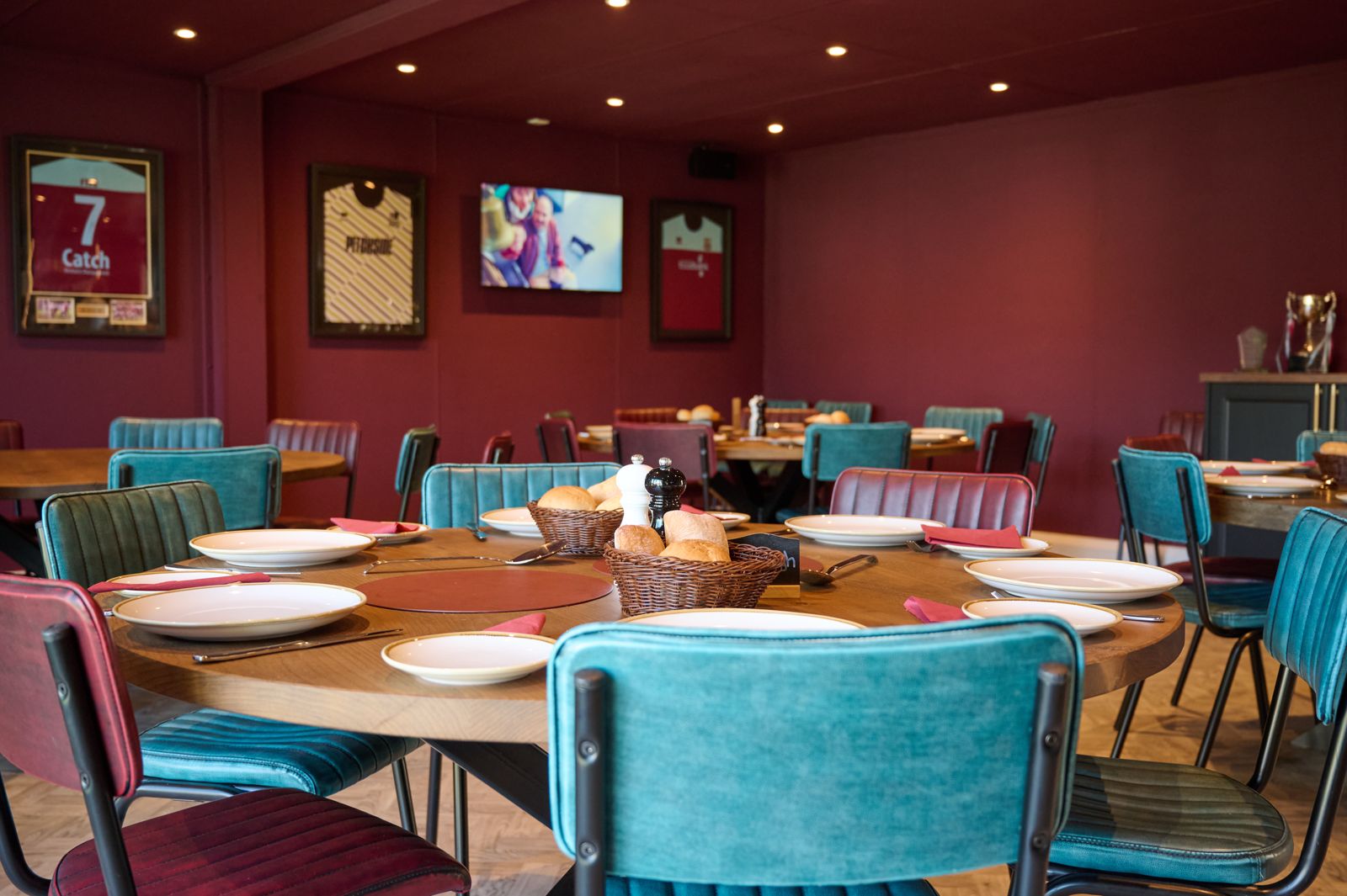The 1906 Club lounge with round dining tables